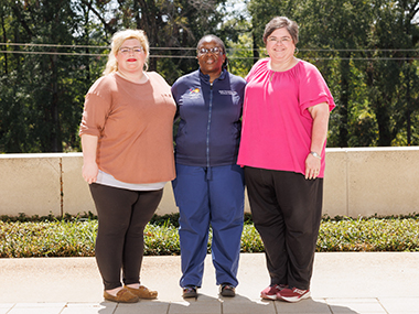 Outdoor group picture of three Neonatal-Perinatal Medicine Fellowship staff members.